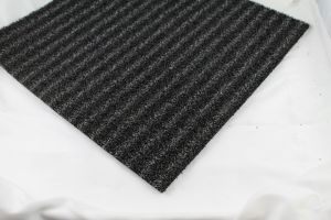 grey and black striped outdoor mat